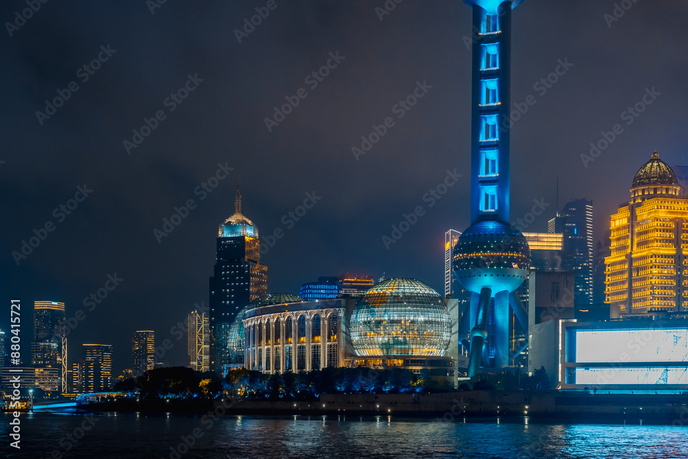 Naklejka premium Urban skyscrapers in Shanghai at night; 