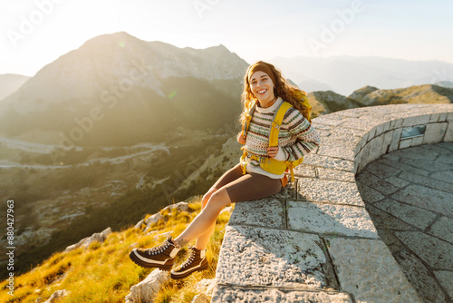 Young woman- tourist on the top of famous place. Negosh Mausoleum. Travel, nature, trip concept. photo