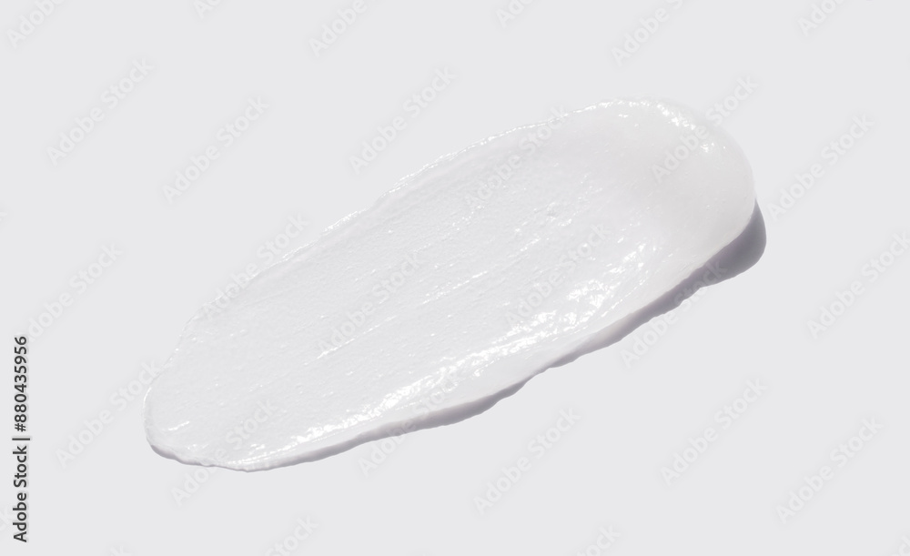 sample smear of cosmetic peeling gel on a light gray background close-up sample smear of cosmetic peeling gel on a light gray background close-up