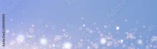 Festive vector background for holidays, presentations, covers, holiday design. Fairy-tale effect of shining light bokeh gently flying on a gentle blue background bathed in the rays of the warm sun.