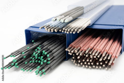 Colorful welding rods/ electrodes with different colors. Welding electrodes with various coating colors for different welding applications on white background. TIG/MIG rods high-quality image. 