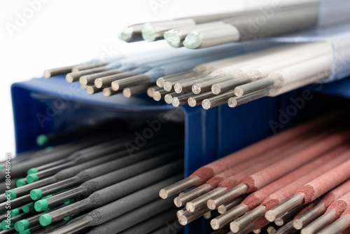 Colorful welding rods/ electrodes with different colors. Welding electrodes with various coating colors for different welding applications on white background. TIG/MIG rods high-quality image. 