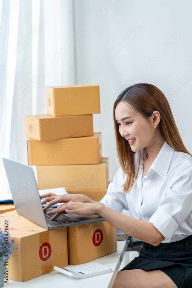 Portrait of Starting small businesses SME owners female entrepreneurs working on receipt box and check online orders to prepare to pack the boxes, sell to customers, SME business ideas online. Portrait of Starting small businesses SME owners female entrepreneurs working on receipt box and check online orders to prepare to pack the boxes, sell to customers, SME business ideas online.