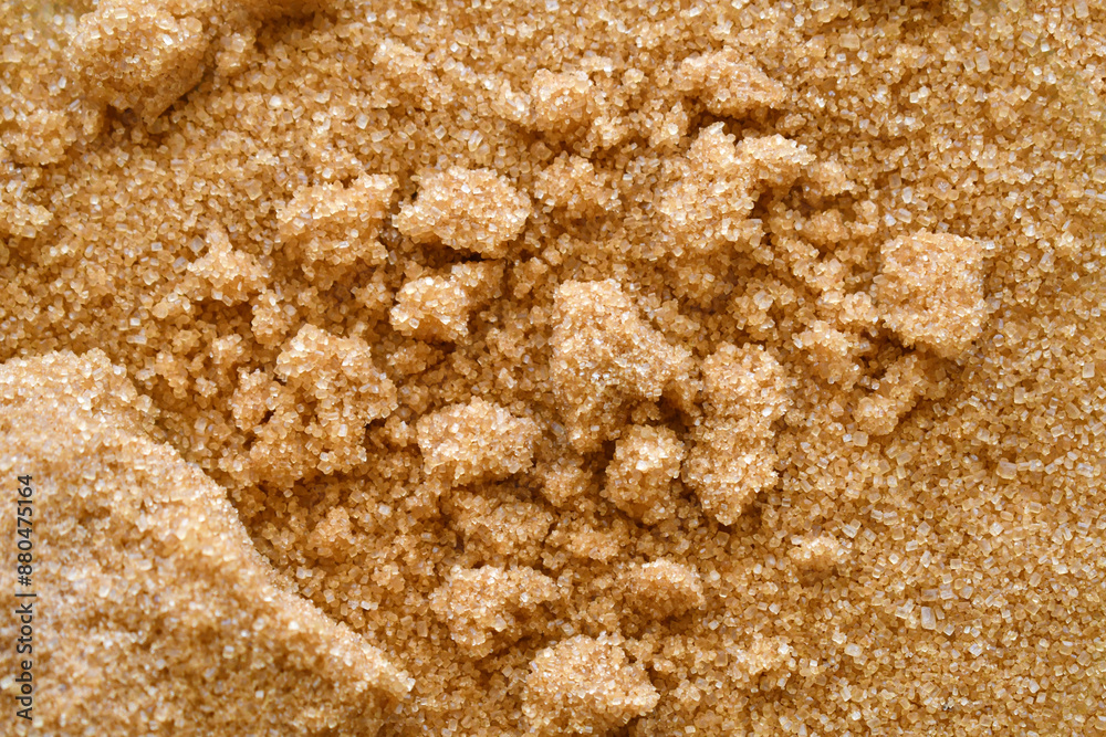 Clumped brown sugar texture background. Cooking preparation concept.