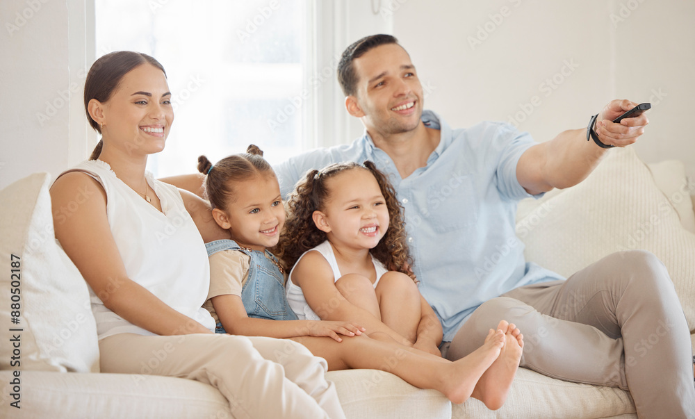 Remote, family and sofa for streaming, tv and series for relax in home living room. Smile, girls and parents for educational show in lounge, mother and dad person for bonding and teaching children Remote, family and sofa for streaming, tv and series for relax in home living room. Smile, girls and parents for educational show in lounge, mother and dad person for bonding and teaching children