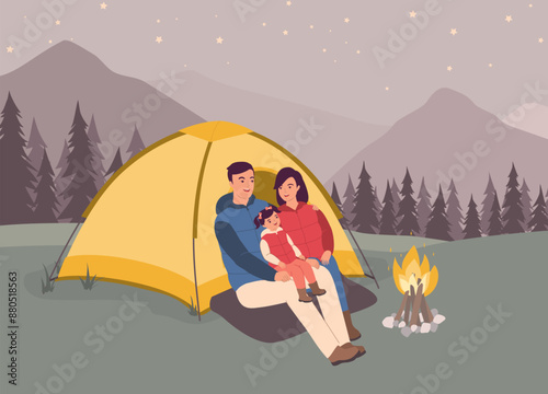 Smiling Family With One Daughter Sitting Outside The Tent Enjoying The Campfire In The Forest.