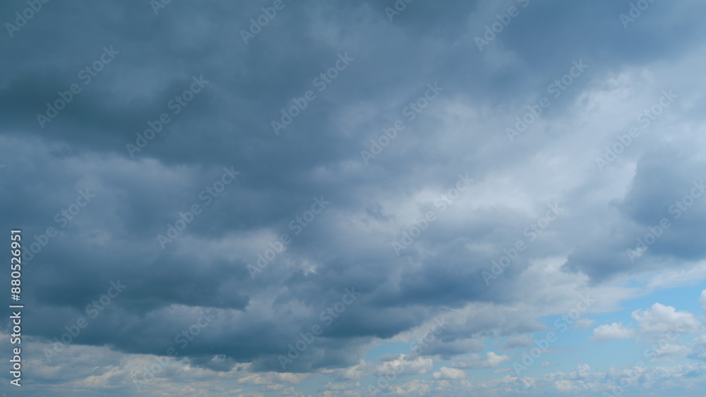 Obraz premium Nature storm cloud in the cloudy sky. Moving rain clouds after bad weather. Time lapse.