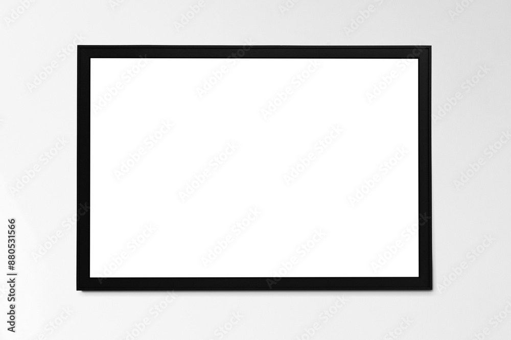 Black picture frame mockup hanging on a wall Black picture frame mockup hanging on a wall
