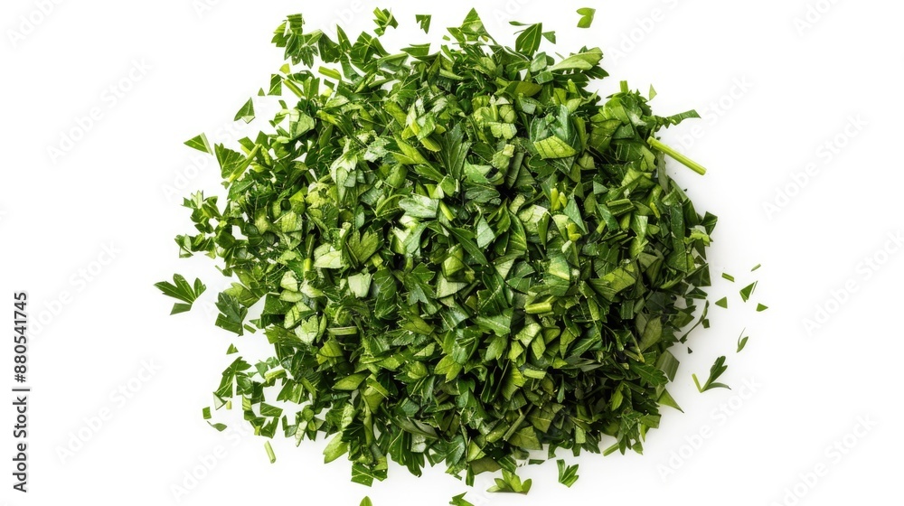 Fresh parsley chopped and arranged on a white surface, ideal for food styling or photography Fresh parsley chopped and arranged on a white surface, ideal for food styling or photography
