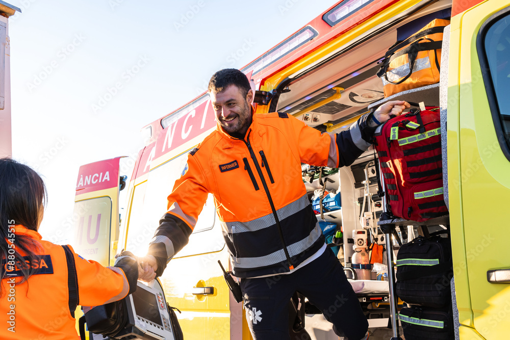 Paramedics working at the ambulance. Paramedics working at the ambulance.