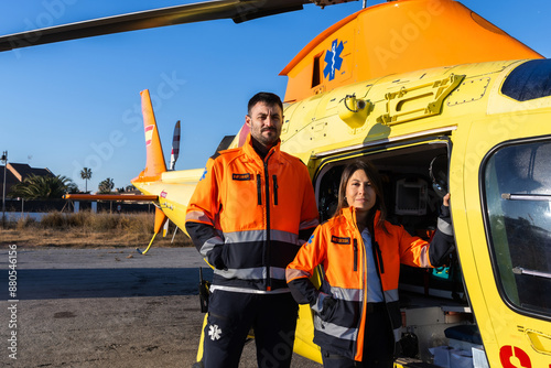 Team work of doctors standing outside the medical helicopter