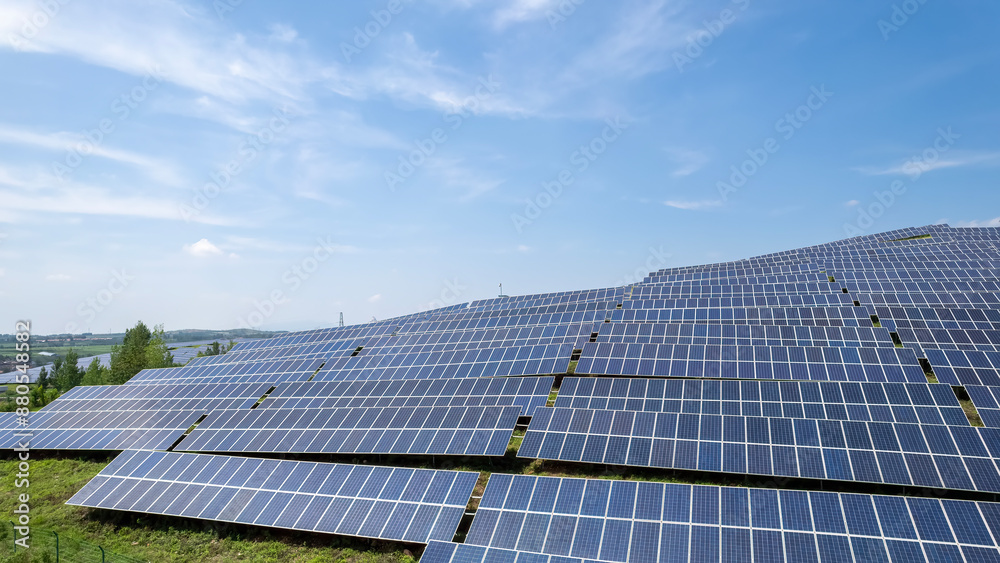 Solar Farm Under Clear Blue Sky in Rural Landscape