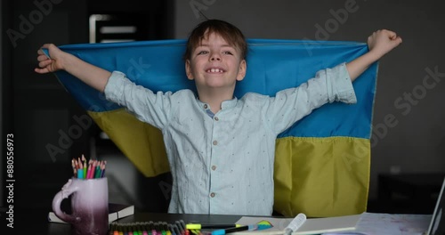 Little boy smiling holding a yellow and blue flag Ukraine. Ukrainian child. Independence Day of Ukraine. Flag Day. Immigration and refugees help. video footage 4k