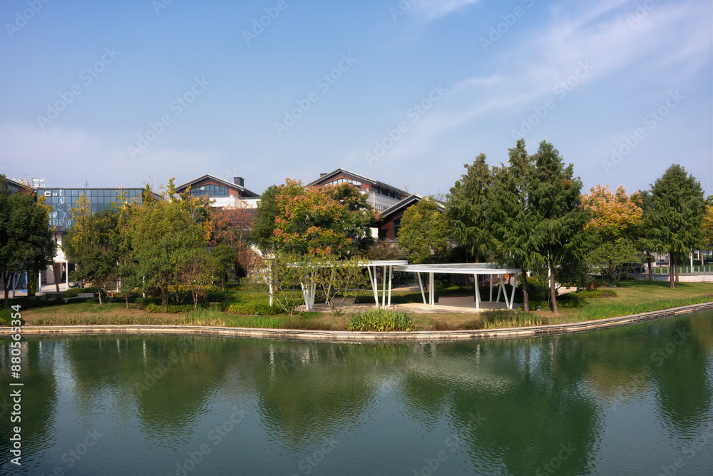 Tranquil Lakeside Architecture with Lush Greenery