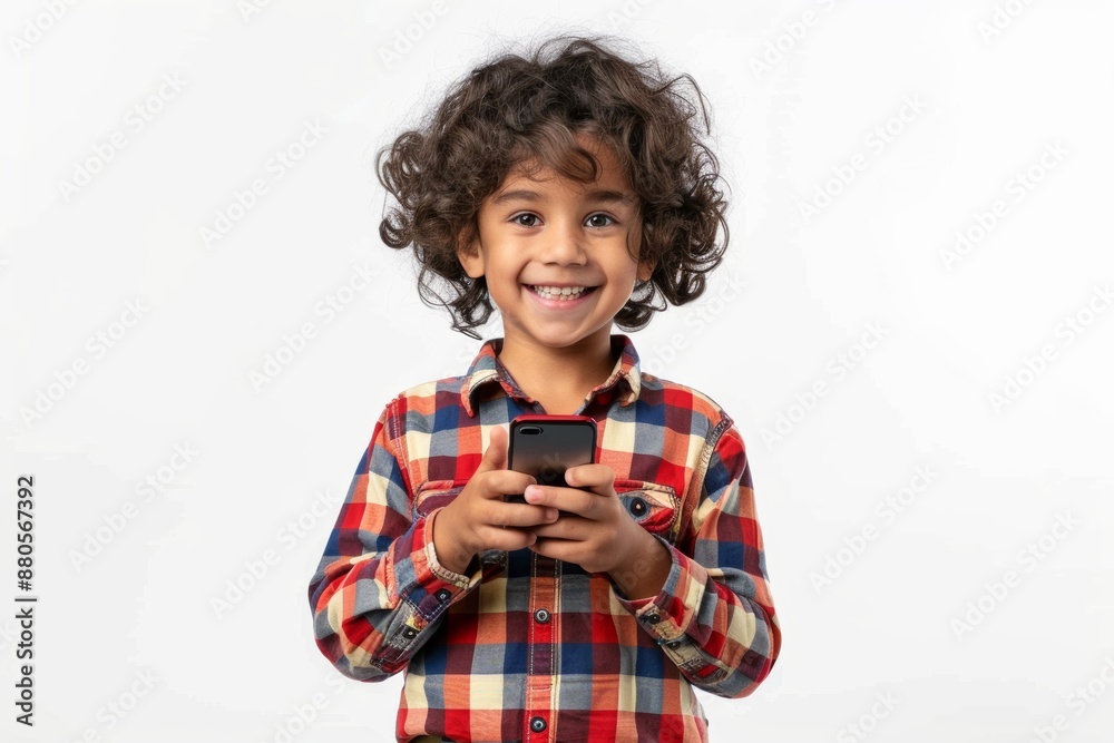 smiling diverse kid isolated on white background, using mobile phone or smartphone, playing a kids game app smiling diverse kid isolated on white background, using mobile phone or smartphone, playing a kids game app