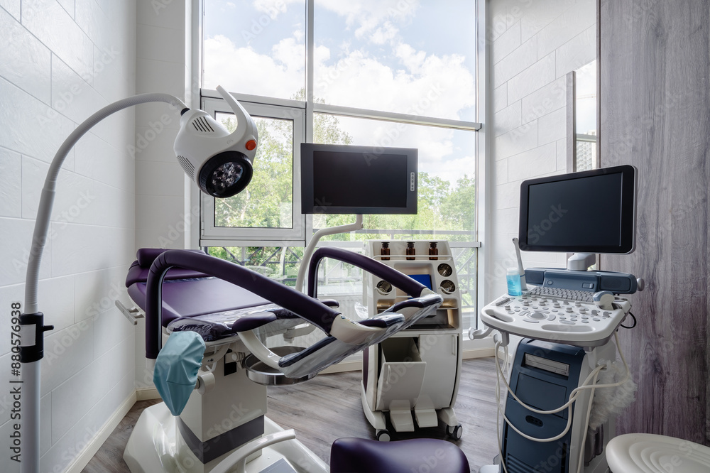 Gynecologist's chair and ultrasound machine in a gynecologist clinic Gynecologist's chair and ultrasound machine in a gynecologist clinic