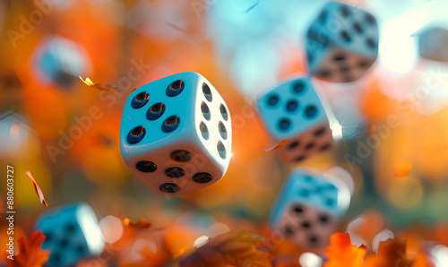 Fototapeta Naklejka Na Ścianę i Meble -  Blue dice fall against a blurry background of orange and yellow autumn leaves