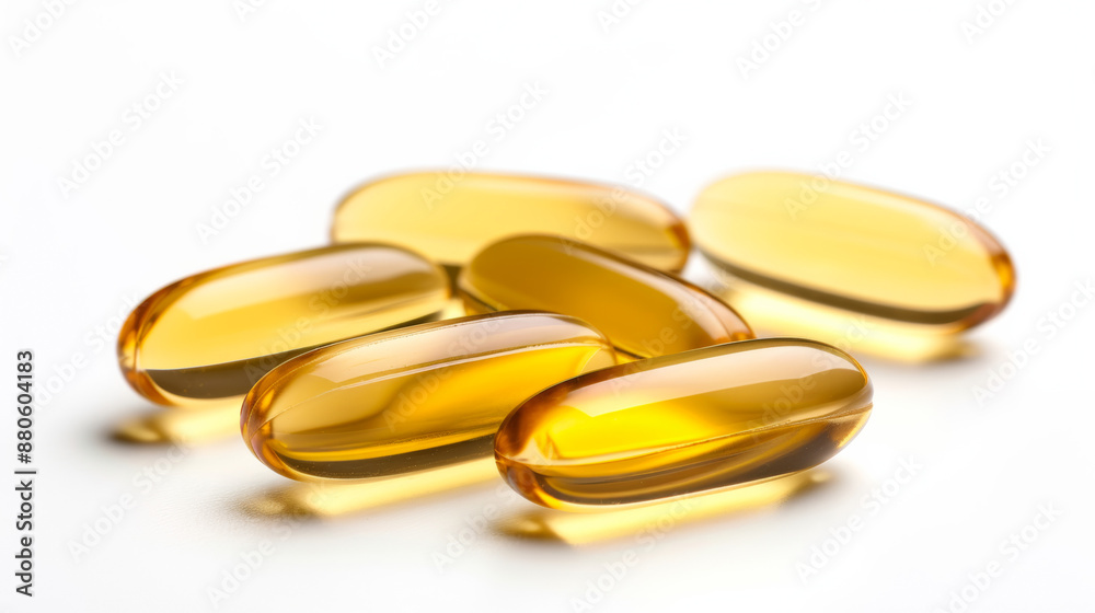 scattered omega-3 fish oil capsules, isolated on a white background, shiny and smooth scattered omega-3 fish oil capsules, isolated on a white background, shiny and smooth