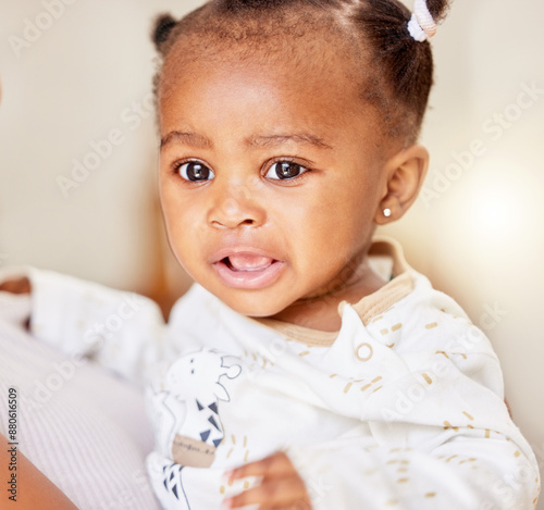Black baby, girl and sad portrait in home for tired or hungry, gas pain and sleep regression or boredom with curious for playing. Toddler, house and unhappy for diaper change and overstimulation.