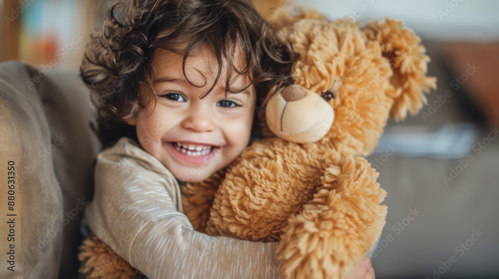 A toddler playing with a plush toy, hugging it tightly with a big smile A toddler playing with a plush toy, hugging it tightly with a big smile