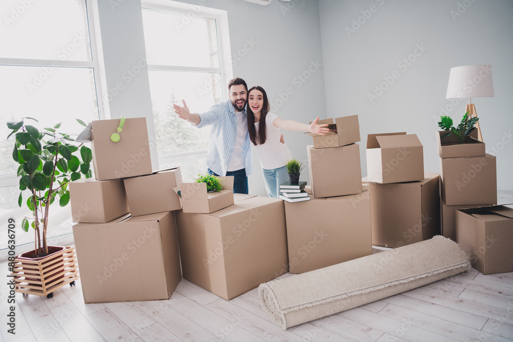 Fototapeta premium Full size photo of two young partners arms welcome you relocating moving box package new modern flat indoors