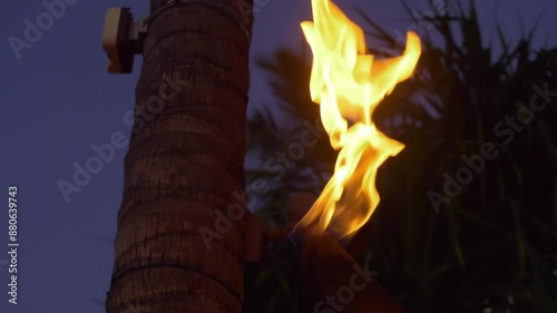 Tiki torch at night in Waikiki in Honolulu, Hawaii in 4k slow motion 60fps