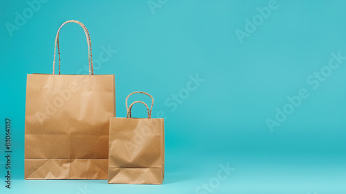 a brown color paper shopping bag set on blue background