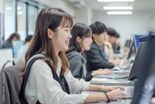 Gorgeous woman is in the front of her colleagues. Four people are working in the office together