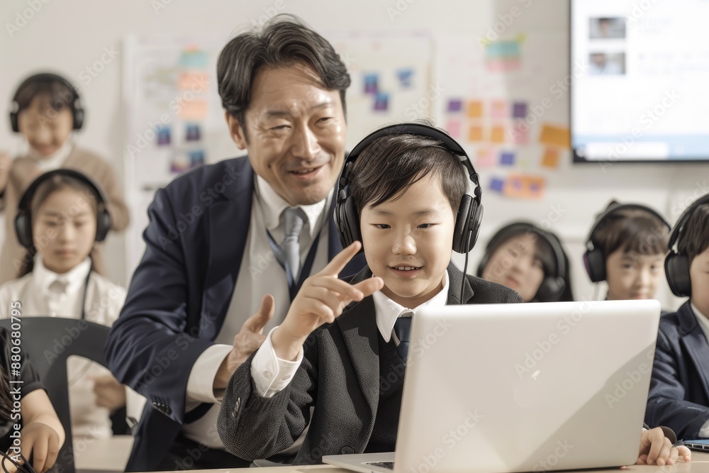Obraz premium elementary school teacher teaching in computer room