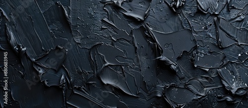 Canvas background textured with black oil paint provides ample copy space for design