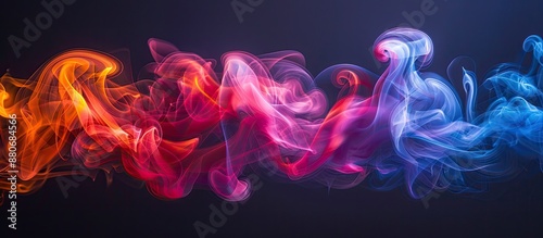 A smoke swirl captured in a studio creating a stunning visual effect with vibrant color hues against a blank backdrop providing a captivating copy space image