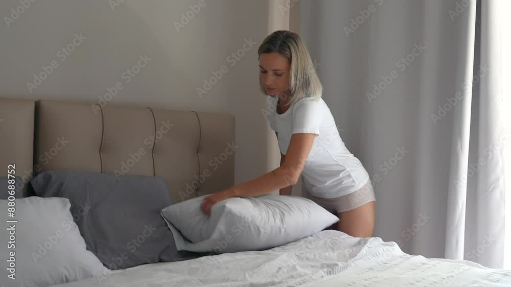 young woman works in the bed young woman works in the bed
