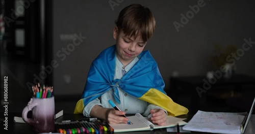 Little boy smiling holding a yellow and blue flag Ukraine. Ukrainian child. Independence Day of Ukraine. Flag Day. Immigration and refugees help. video footage 4k