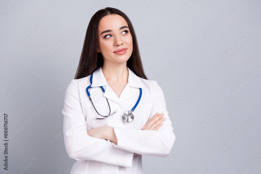 Portrait of qualified doctor woman folded hands look empty space white coat isolated on grey color background Portrait of qualified doctor woman folded hands look empty space white coat isolated on grey color background