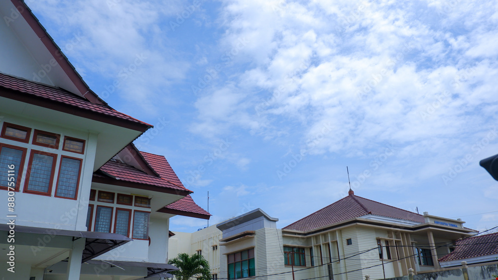 Office Buildings In The Morning With A View Of A Clear, Cloudy Sky Office Buildings In The Morning With A View Of A Clear, Cloudy Sky