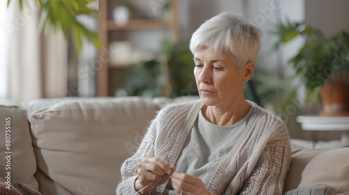 The Woman Knitting at Home photo