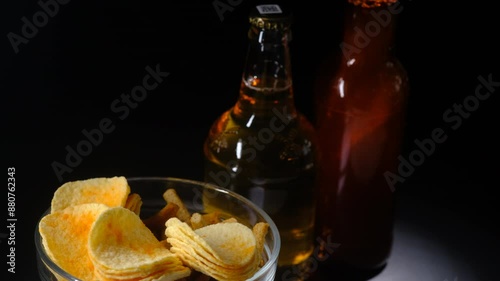 beer and chips on a black background