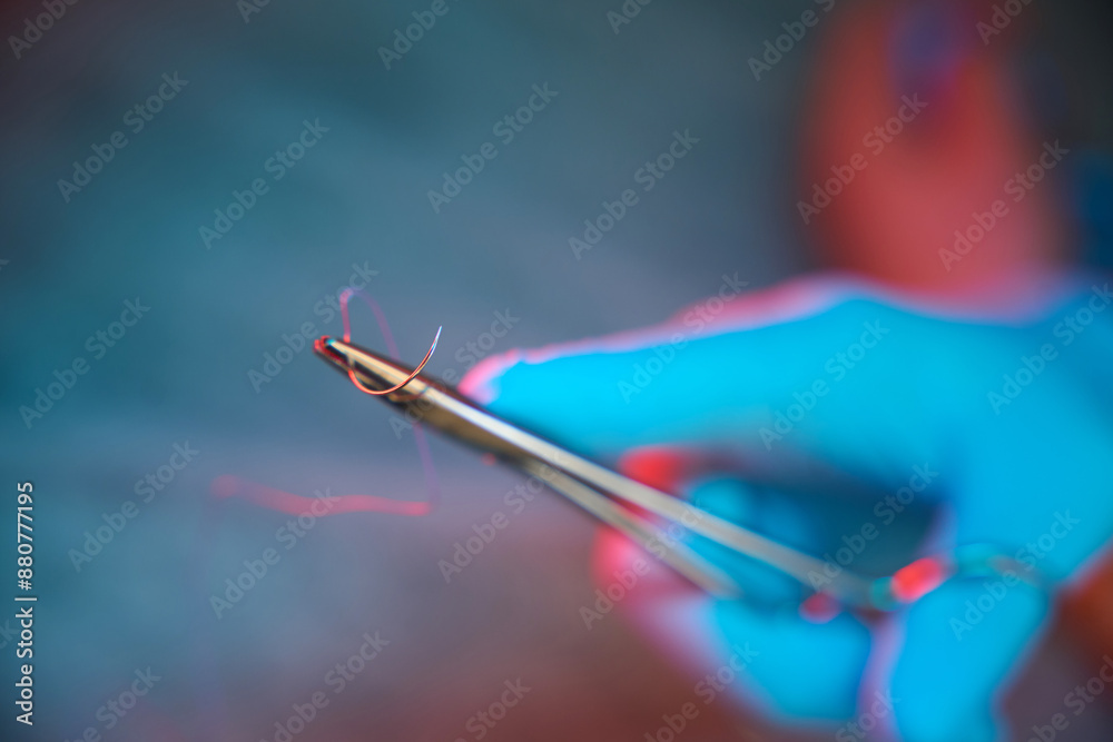 Doctor using sharp-blade cutting instrument during surgery Doctor using sharp-blade cutting instrument during surgery