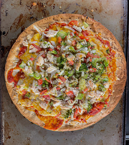 cauliflower pizza crust with chicken and vegetables  photo