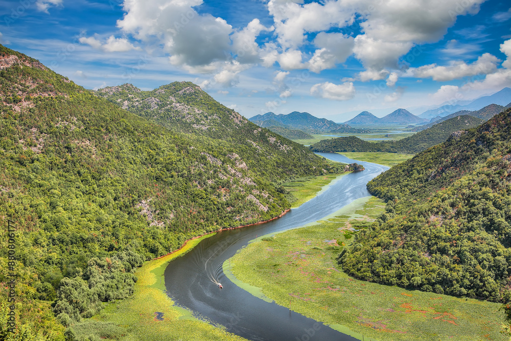 Captivating view of the Crnojevic river bend around green mountain peaks on a sunny day. Captivating view of the Crnojevic river bend around green mountain peaks on a sunny day.