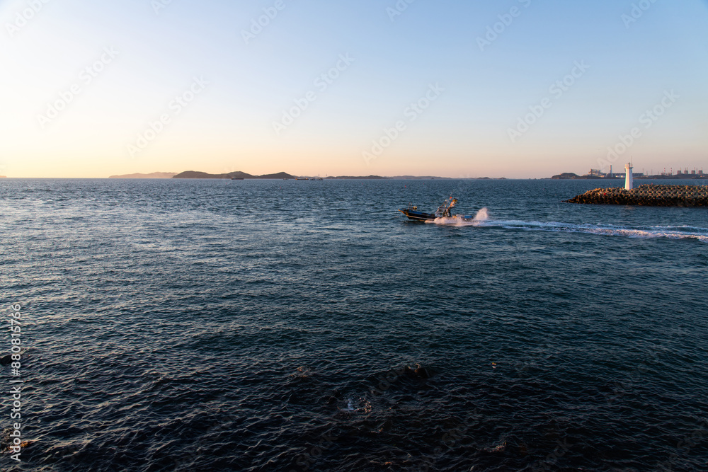 fishing boat on the sea in late afternoon fishing boat on the sea in late afternoon