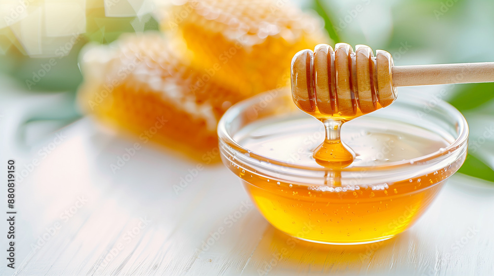 Organic Honey in Glass Bowl with Honey Dipper. Pure Bee Honey and Honeycomb Close Up Organic Honey in Glass Bowl with Honey Dipper. Pure Bee Honey and Honeycomb Close Up