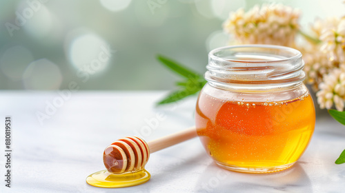 Natural Honey in Glass Jar. Close-Up of Honey Drizzler and Fresh Honey