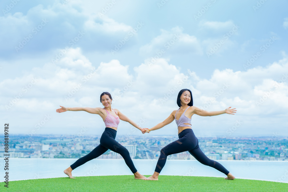 yoga, Asian woman wearing yoga clothes practicing yoga, Asia group of women exercising healthy lifestyle in outdoor fitness studio. swimming pool. Sport activity, gymnastics or ballet dancing class. yoga, Asian woman wearing yoga clothes practicing yoga, Asia group of women exercising healthy lifestyle in outdoor fitness studio. swimming pool. Sport activity, gymnastics or ballet dancing class.