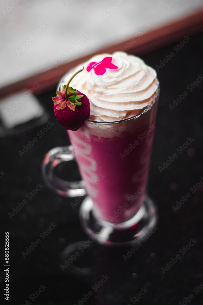 Glass of strawberry lemonade with icecream Glass of strawberry lemonade with icecream
