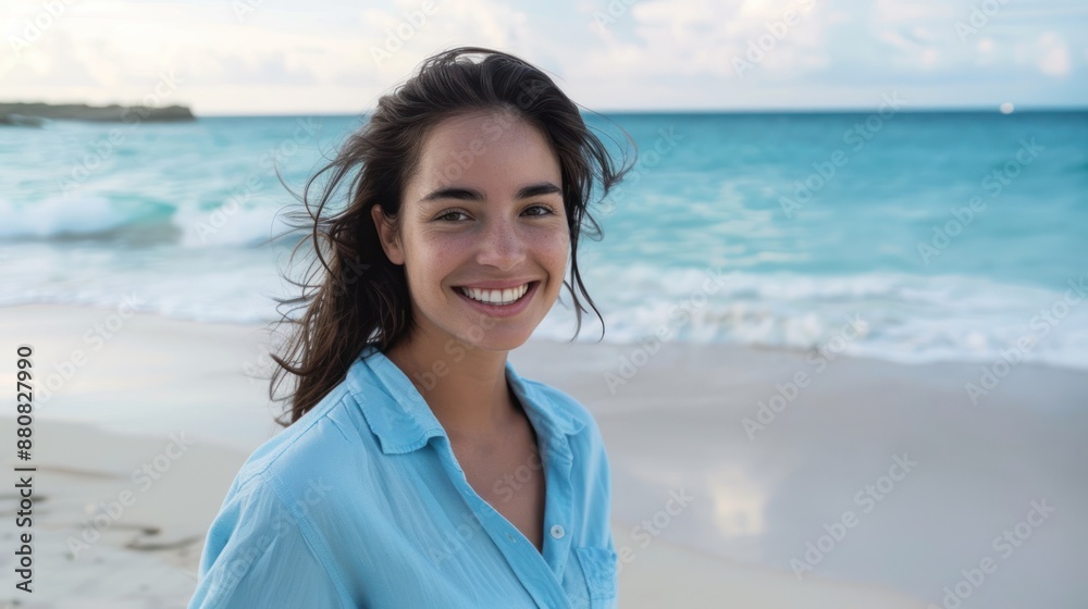 Portrait of a beautiful woman smiling at the camera on the beach, a young Latin Hispanic girl standing at the beach. Happy girl in a casual outfit with wind in her hair. enjoying vacation. Portrait of a beautiful woman smiling at the camera on the beach, a young Latin Hispanic girl standing at the beach. Happy girl in a casual outfit with wind in her hair. enjoying vacation.
