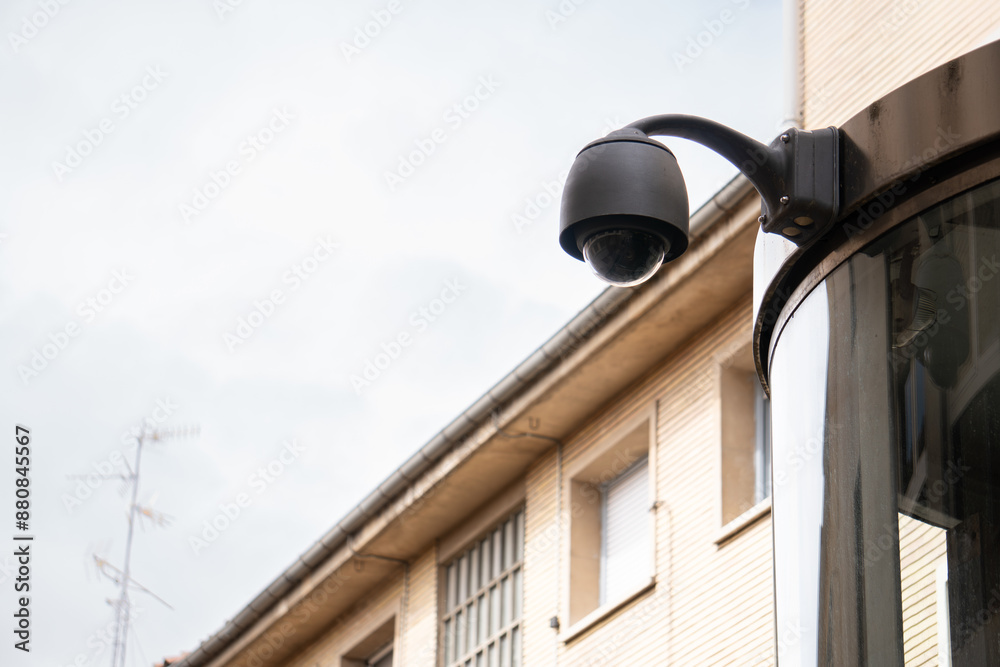 Security surveillance cameras in front of high-rise condominium. CCTV camera home security system. A camera is mounted on a pole in front of a building is black and has a round lens. recognition, AI, Security surveillance cameras in front of high-rise condominium. CCTV camera home security system. A camera is mounted on a pole in front of a building is black and has a round lens. recognition, AI,