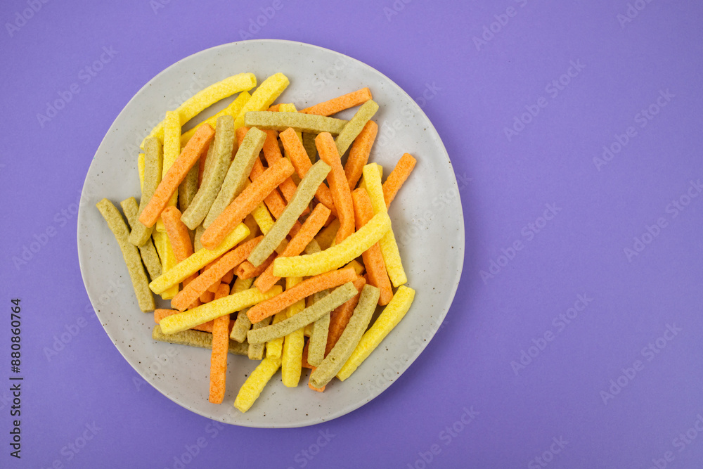 Potato vegetable chips baked with herbs on dish