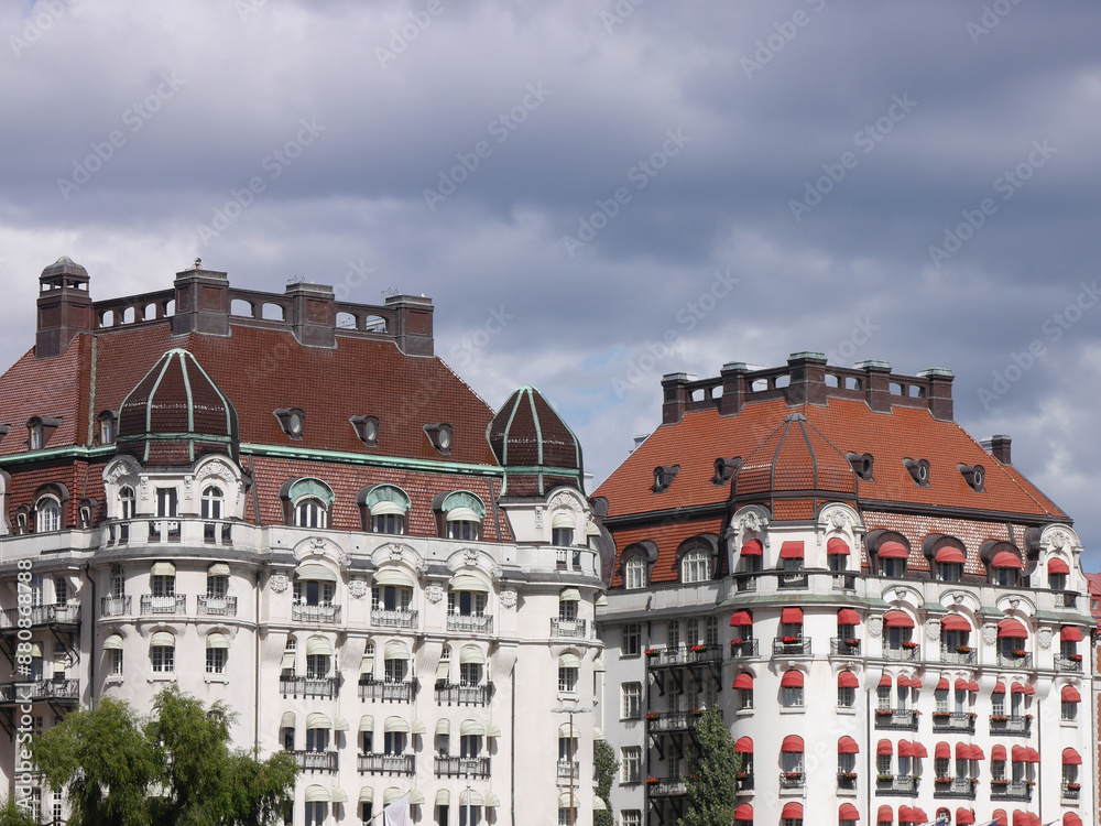 Two beautiful buildings against cloudy sky Two beautiful buildings against cloudy sky