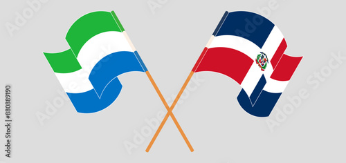 Crossed and waving flags of Sierra Leone and Dominican Republic